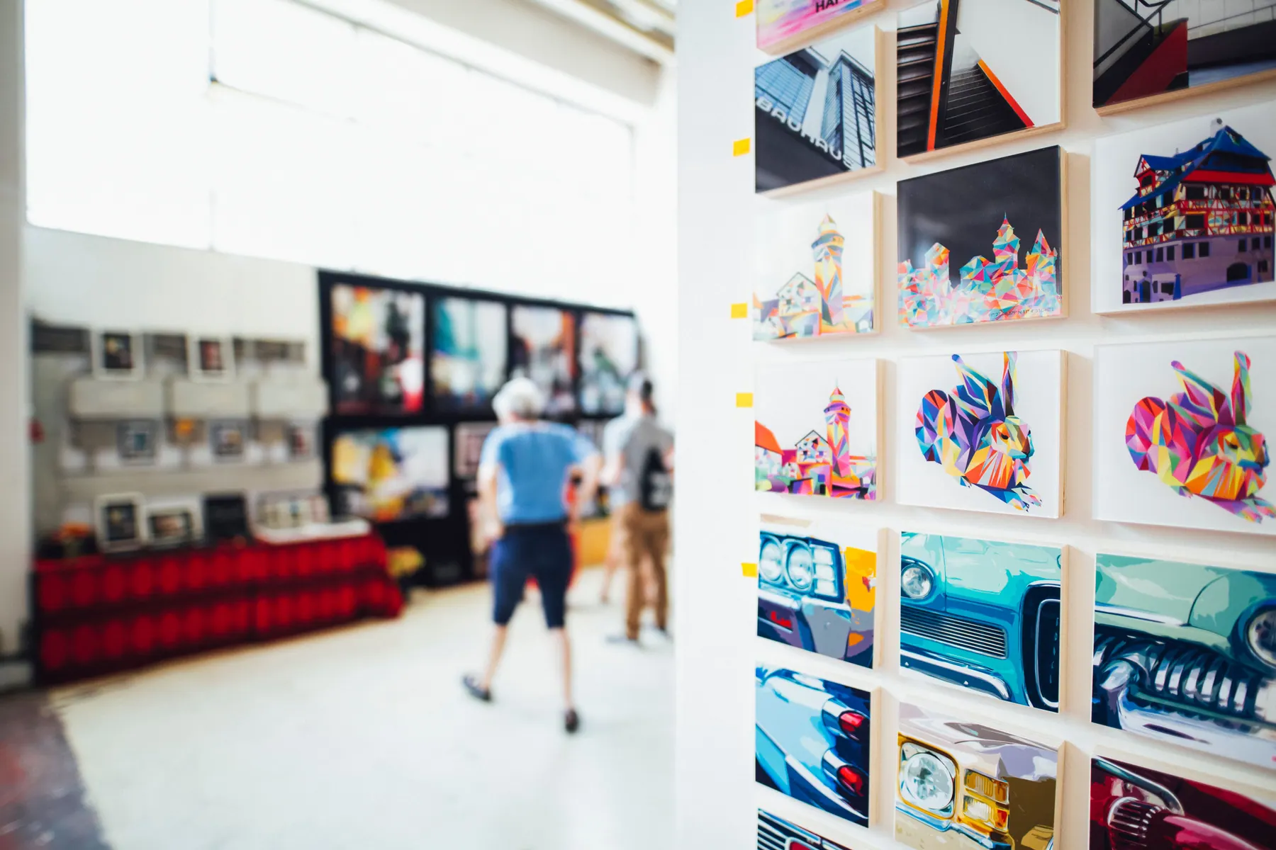 Colorful contemporary artwork arranged in a bright gallery