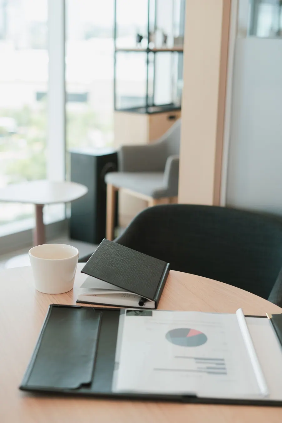 Organized documents and notebook on a quiet consultation table