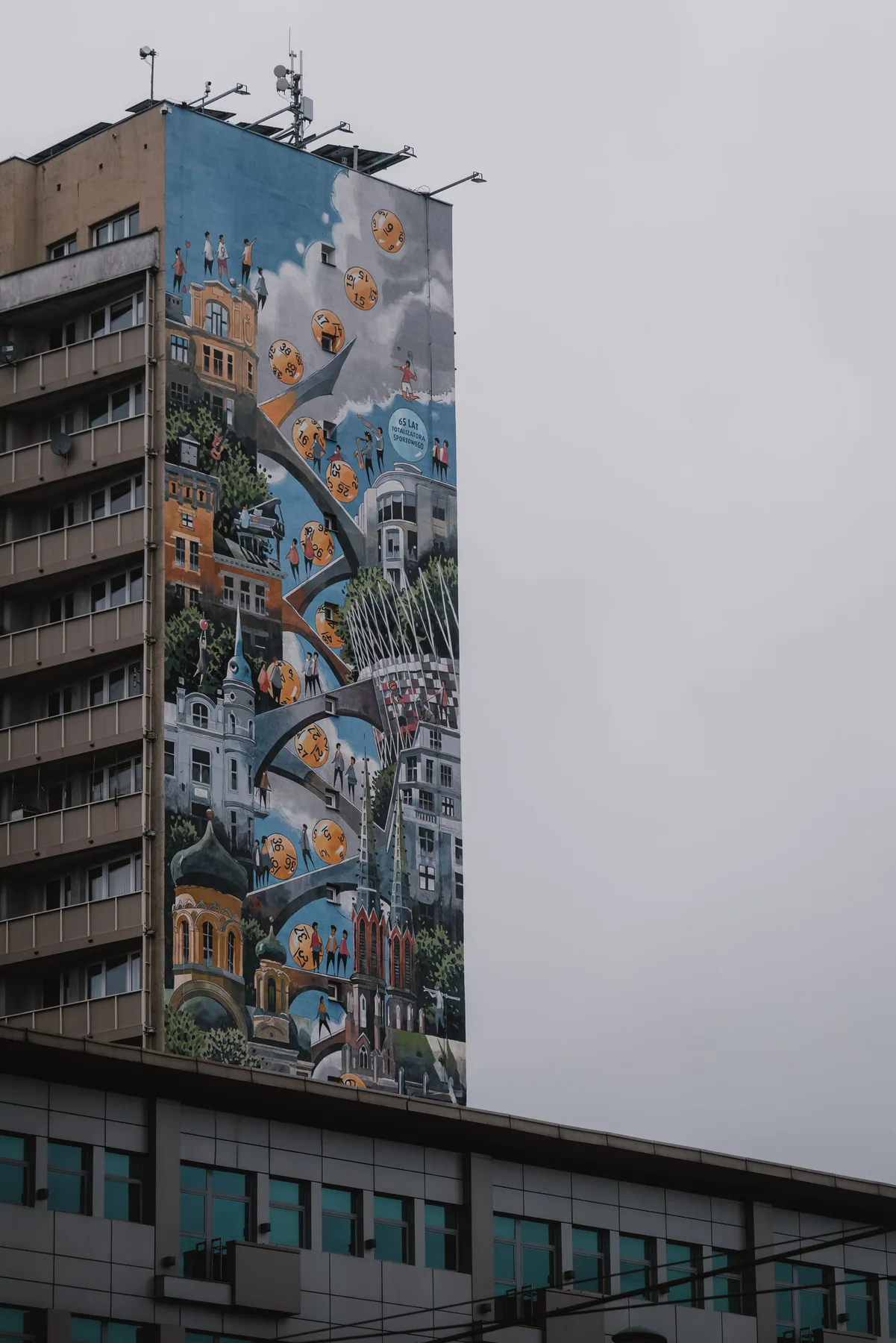 Large mural covering the side of an urban building